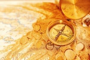 Treasure map with compass and gold coins