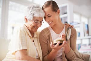 This is their family heirloom. Cropped shot of a senior woman giving her daughter a pearl necklace.